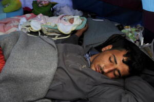 Syrian refugee Saad sleeps next to his 10-day-old daughter Yasmine, who was born at a Greek hospital, at a makeshift camp for migrants and refugees at the Greek-Macedonian border near the village of Idomeni, Greece, April 23, 2016. REUTERS/Alexandros Avramidis