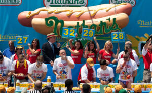 Competitive eaters compete in the men's division of the Nathan's Famous International Hot Dog Eating Contest at Coney Island on July 4, 2012 in the Brooklyn borough of New York City. (Andrew Burton/Getty Images)