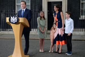 TOPSHOT - Outgoing British prime minister David Cameron speaks beside (L-R) his daughter Nancy Gwen, daughter Florence Rose Endellion, his wife Samantha Cameron and son Arthur Elwen outside 10 Downing Street in central London on July 13, 2016 before going to Buckingham Palace to tender his resignation to Queen Elizabeth II. Outgoing British prime minister David Cameron urged his successor Theresa May on Wednesday to maintain close ties with the EU even while negotiating to leave it, as he paid a fond farewell to MPs hours before leaving office. Cameron will tender his resignation on July 13 to Queen Elizabeth II at Buckingham Palace, after which the monarch will task the new leader of the Conservative Party Theresa May with forming a government. / AFP / OLI SCARFF (Photo credit should read OLI SCARFF/AFP/Getty Images)